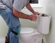 a Southlake plumber is inspecting the toilet