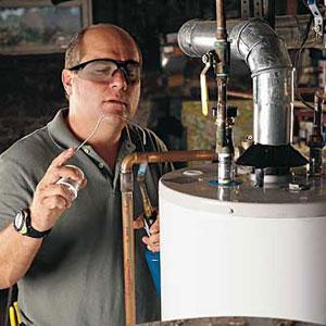 a Southlake plumber technician is fixing a water heater